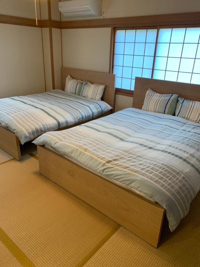 Guest House Apple Osaka Buitenkant foto